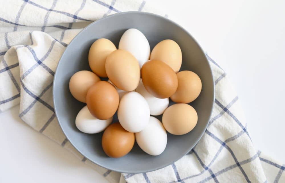Plate with raw eggs.