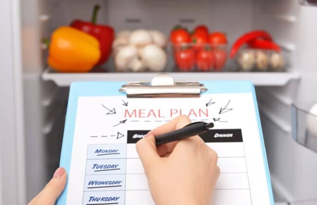 Woman making meal plan.