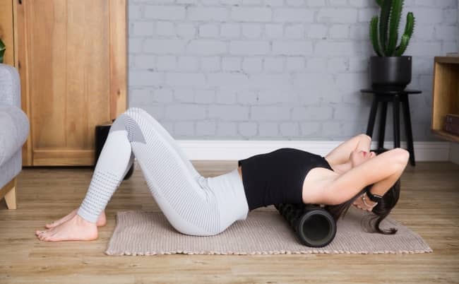 Using a foam roller helps break up muscle “adhesions” that can cause soreness or inhibit performance